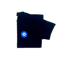 Load image into Gallery viewer, Blue Evil Eye embroidered on a black cotton unisex t-shirt. Featured on white background image.
