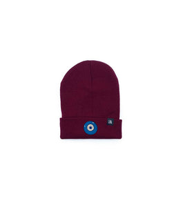 Blue Evil Eye embroidered on a burgundy acrylic beanie, with an RA Attire woven logo label. Featured on white background image.