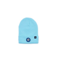 Load image into Gallery viewer, Blue Evil Eye embroidered on an aqua blue acrylic beanie, with an RA Attire woven logo label. Featured on white background image.
