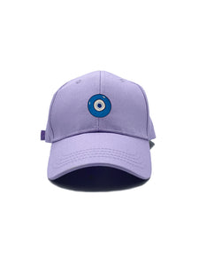 Blue Evil Eye embroidered on a lavender purple cotton dad hat / cap. Featured on white background image.