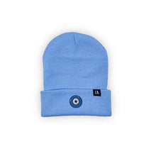 Load image into Gallery viewer, Blue Evil Eye embroidered on a periwinkle blue acrylic beanie, with an RA Attire woven logo label. Featured on white background image.