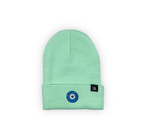 Blue Evil Eye embroidered on a mint green acrylic beanie, with an RA Attire woven logo label. Featured on white background image.